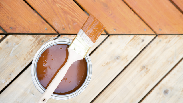 Exterior Painters in Ann Arbor showcase a before and after of a deck stain