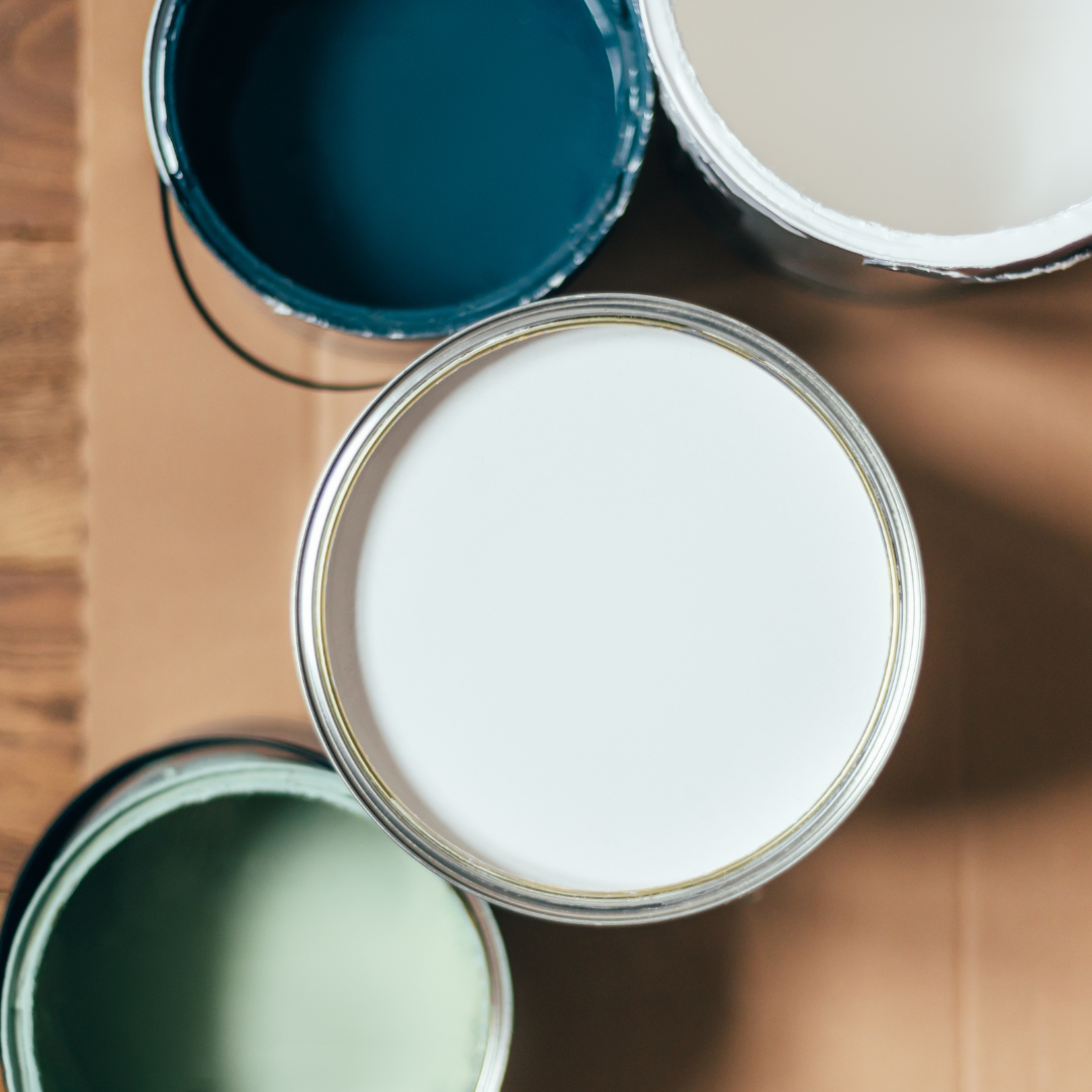 Painting Company in Ann Arbor staged open paint cans of a variety of colors