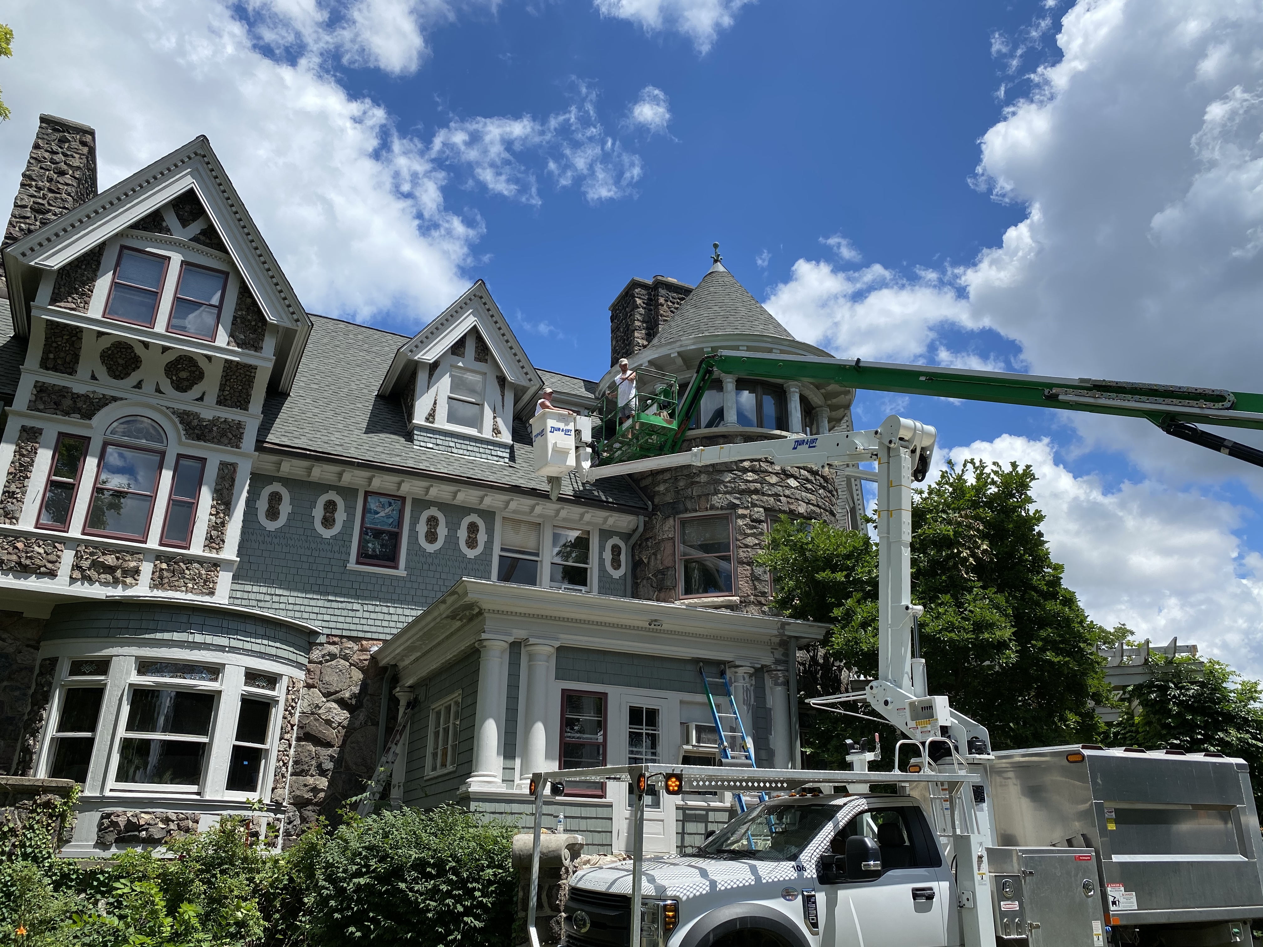 Exterior painters working on an Ann Arbor home
